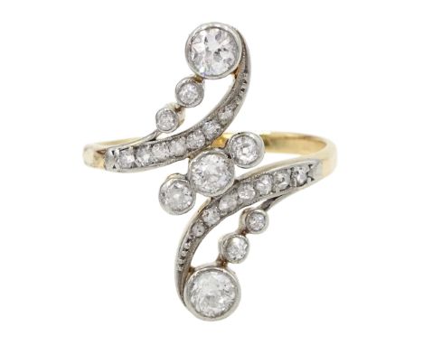 Art Nouveau gold and platinum milgrain set old cut diamond crossover twist ring, circa 1910-1920Condition Report:Approx 3.55g