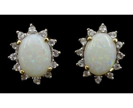 Pair of gold opal and cubic zirconia cluster stud earrings, stamped 10KCondition Report:Approx 2.2gm, length = 11mm, good con