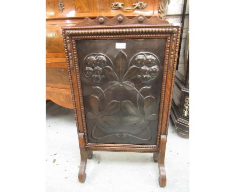 Arts and Crafts oak and embossed patinated copper fire screen decorated with a horse chestnut design, 74cm highIn good origin
