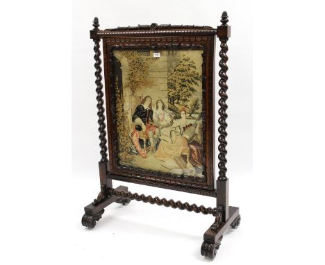 Good quality William IV rosewood fire screen, inset with a woolwork panel of figures before a building, 78cm wide x 115cm hig