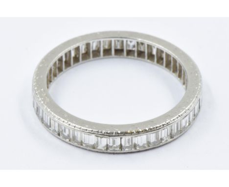 Diamond baguette set full eternity ring in a white metal mount, size N, 3gDeep marks and wear to the edges of the band consis