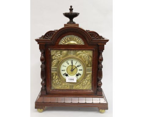 19th Century walnut and brass mounted mantel clock, the circular dial with white chapter ring having Roman numerals and two t