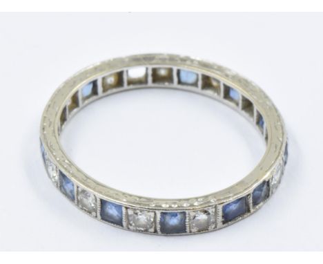 White metal sapphire and diamond set full eternity ring, size N, 2.2gThe decoration on shank is very worn, one sapphire is mi