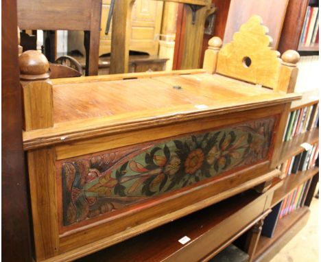 Continental exotic hardwood floral carved and painted trunk / bench, having pierced ends and hinged centre panel on low suppo
