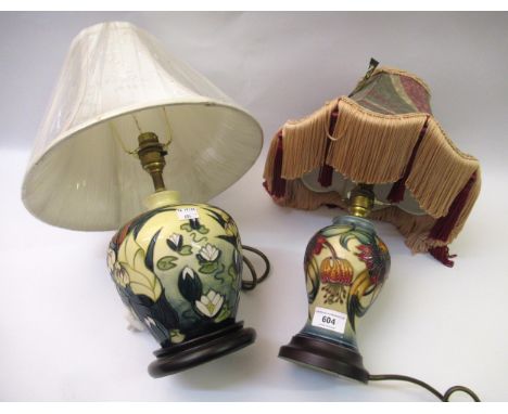 Modern Moorcroft table lamp with a design of lily pads and bulrushes on a cream ground, 18cm high excluding the base and lamp