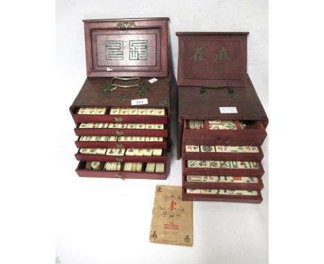 Two Chinese bone and bamboo mahjong sets housed in wooden cases