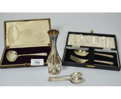 Silver Christening spoon and fork in a fitted case, another silver spoon in a fitted case, four silver coffee spoons and a Co