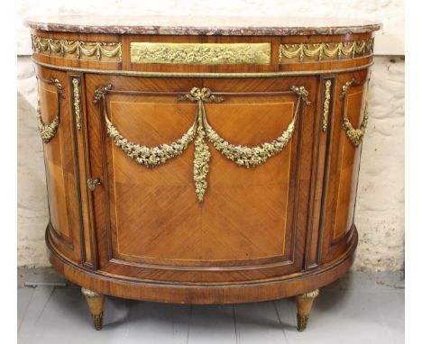 Late 19th / early 20th Century French Kingwood and ormolu mounted demi lune commode, the rouge marble top above a central doo