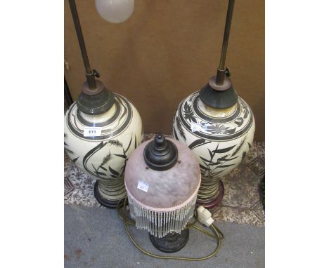 Pair of large baluster form pottery table lamps with floral decoration, together with a modern brown patinated metal figural 