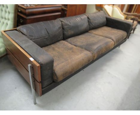 Robin Day for Hille circa 1970, exotic hardwood and chrome, leather upholstered three seat Forum sofa, 215cm wide x 77cm deep