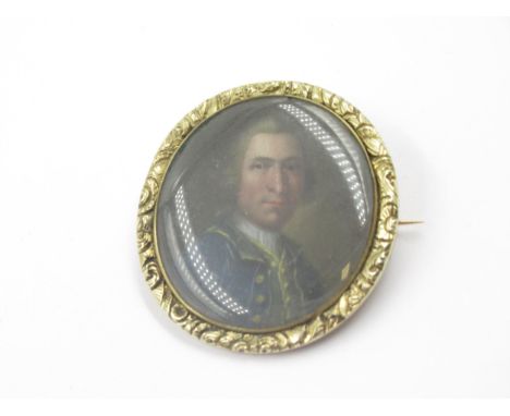 19th Century oval portrait miniature in a gold mountDimensions are 37 x 32mm overall.Some scratching to glass, otherwise in g