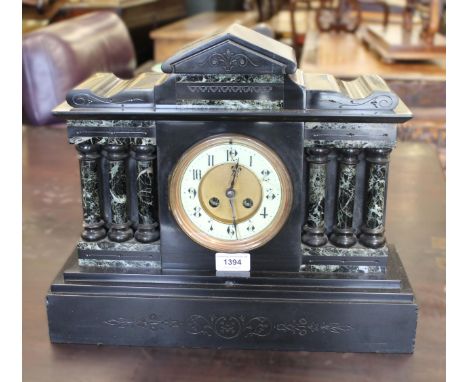 19th Century black slate two train mantel clock, the circular dial with Arabic numerals and two train movement, striking on a