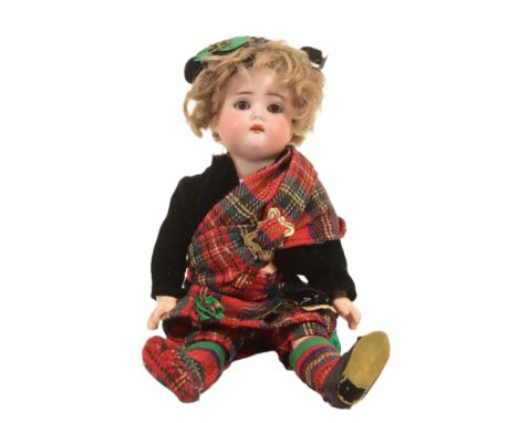 An early 20th Century German Simon &amp; Halbig bisque headed doll. Brown flirty eyes, finely painted brows and lashes, open 
