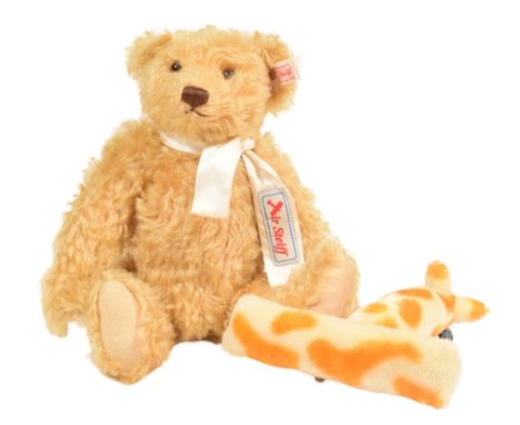 Teddy Bears - an original German Steiff ' Teddy Bear with Rackerplan '. The blonde mohair bear with a goldfish-design plane w