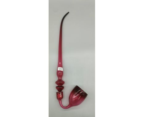 A Vintage Cranberry glass large pipe. [68cm length] 