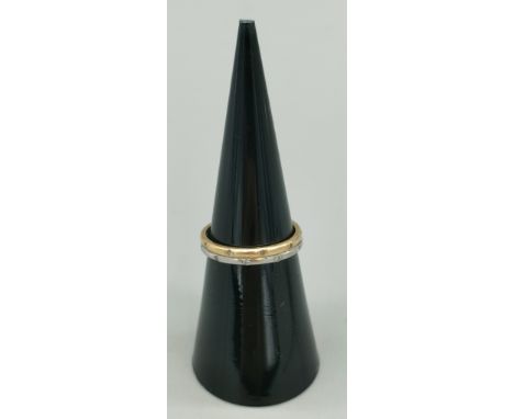 18ct white and yellow gold wedding band fitted with .14ct diamonds. [Ring size J] [2.54Grams] 
