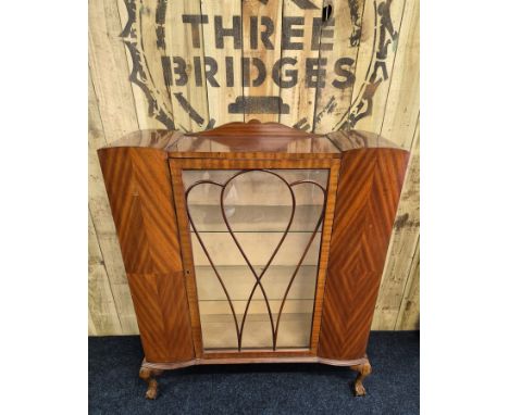 Vintage mahogany and glass display cabinet. Shaped top, glass sides, door and raised on ball and claw feet. [130x104x33cm] 