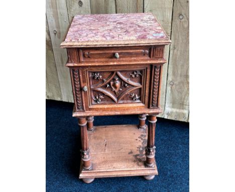 Antique oak and marble top side table. Single drawer and door- interior white marble finish. Raised on bun feet, square shelf