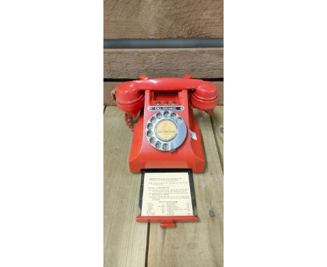 A Vintage GPO Red bakelite dial phone.