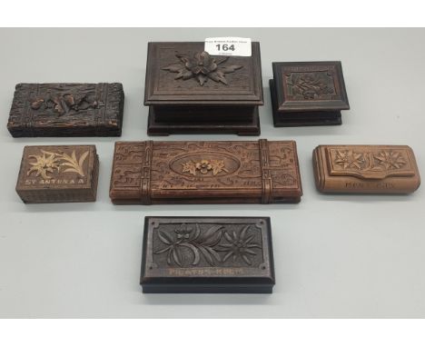 A collection of seven black forest wooden carved boxes; Snuff box, stamp box &amp; others 