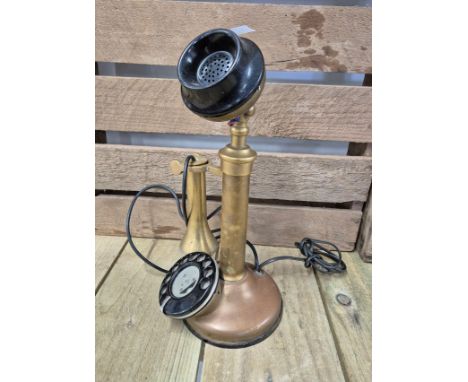 Antique Brass candlestick dial phone with ear piece. 