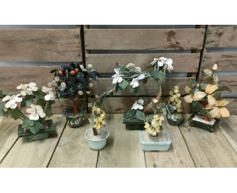 Tray of Chinese hardstone and jade style stone flower design sculptures; One fitted within a cloisonne three foot pot. [Talle