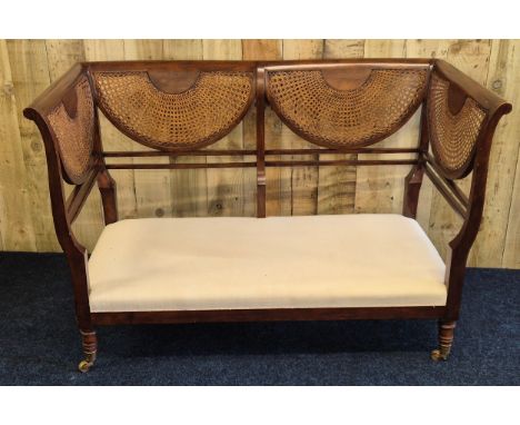 Reproduction of a 19th century mahogany two seat bergere back and side parlour sofa. Comes with removable cushion. Raised on 