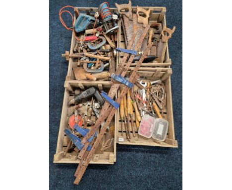 Four crates of various vintage tools; wood turning chisels, large hand drill, callipers, spanners, vintage saws &amp; electri