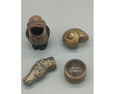 Four various vestas and snuff boxes; Brass horse head vesta, Brass ornate shell snuff box, One Penny Snuff box and hand carve