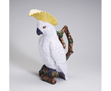 NOVELTY BROWNFIELD MAJOLICA JUG LATE 19TH CENTURY modelled as a cockatoo with vibrant yellow comb and naturalistic branch han