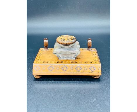 A Tunbridgeware pen stand with central inkwell.