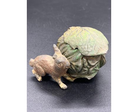 A Cold painted inkwell in the form of a rabbit and a cabbage.