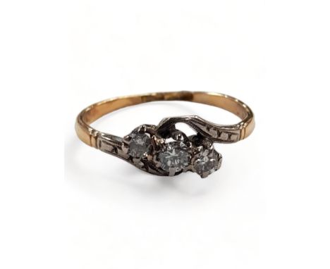 18 CARAT GOLD AND DIAMOND 3 STONE RING WITH 0.2 CARAT OF DIAMONDS