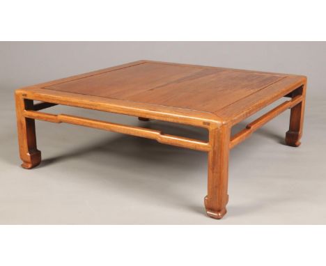 An early 20th century Chinese carved hardwood square low table, 89cm square, 32cm high.  