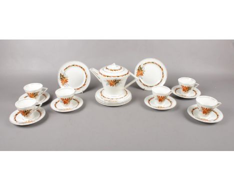 An Art Deco ceramic tea set, teapot, 6 cups &amp; saucers. 6 tea plates.  