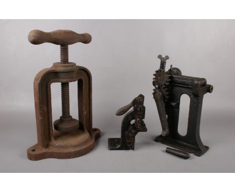 A selection of cast iron industrial cutting tools and screw press.  Please note that the handle has come off one of the tools