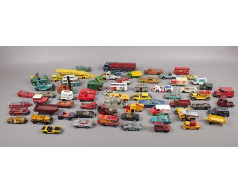 A box of die cast vehicles, Dinky, Corgi, Matchbox examples.  