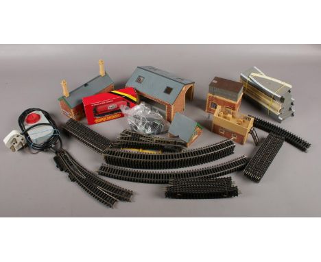 A collection of mainly Hornby model railway, to include tracks, buildings, boxed Texaco wagon, transformer etc.  