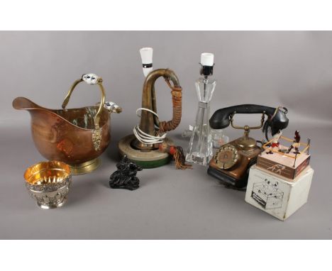 A selection of miscellaneous items to include, a vintage copper and bakelite phone, a brass bugle converted into a desk lamp,