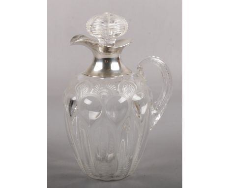 An Edwardian silver mounted cut and blown glass whiskey jug, assayed London 1901 by William Comyns &amp; Sons.  Good conditio