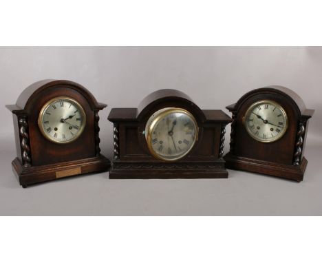 Three wooden mantel clocks comprising of two 'Astral 'oak mantel clocks, one of which was presented to Mr Sydney Smith on the