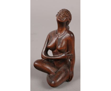 A Japanese fruitwood erotic netsuke (6cm high)  