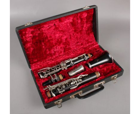 A Noblet of Paris Artist clarinet in carry case.  Missing components.
