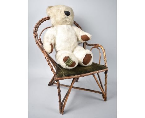 A Merrythought Harrods Teddy Bear and Peacock Armchair 