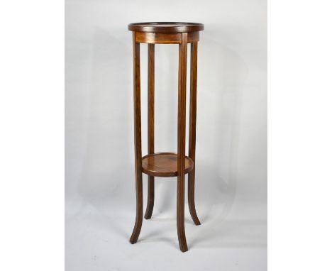 An Edwardian Inlaid Mahogany Circular Torchere Stand with Stretcher Shelf, 32cms Diameter and 98cms High 