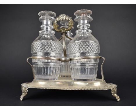 A Georgian Style Three Bottle Tantalus on Silver Plated Stand, Glass Bottles of Mallet Form having Cut Hobnail Design, The St