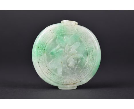 A Chinese Jade Effect Snuff Bottle with carved Decoration, 5cms Diameter 