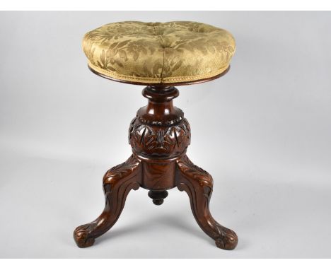 A Late Victorian Carved Mahogany Circular Rise and Fall Piano Stool with Button Upholstered Seat 