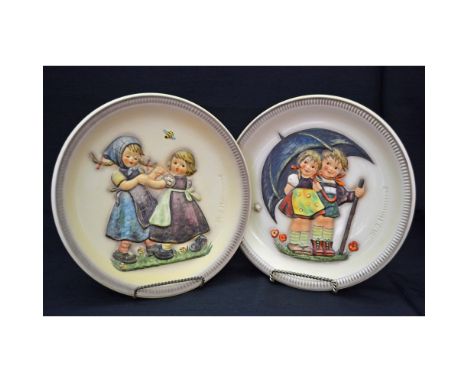Goebel M.J.Hummel Anniversary Annual Plates, featuring the First Edition 1975 Stormy Weather and the Second Edition 1980 Spri