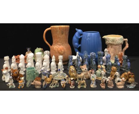 A Denby Byngo miniature dog, brown glaze; a drip-glazed ceramic chess set; Wade Whimsies including Disney; two Beatrix Potter